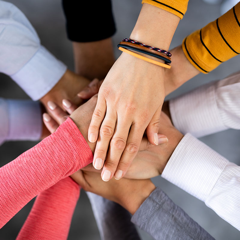 Closeup of people's hands together